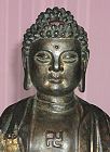 Chinese Buddha - large bronze (15 in. tall) - dated Ming Dynasty - with fine detail on cloak - with WAN symbol on the chest - from the Villa Del Prado Light of Asia Collection